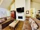 Comfortable clubhouse living room with a fireplace and seating area at 4140 Lanier Ridge Walk # 104, Cumming, GA 30041