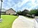 Private gated community entrance with curving driveway at 4140 Lanier Ridge Walk # 104, Cumming, GA 30041