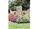 Community entrance with landscaping and brick columns at 4140 Lanier Ridge Walk # 104, Cumming, GA 30041