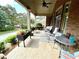 Brick front porch with seating area and planters at 4140 Lanier Ridge Walk # 104, Cumming, GA 30041