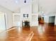 Spacious living room with hardwood floors, fireplace, and built-in shelves at 4140 Lanier Ridge Walk # 104, Cumming, GA 30041