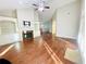 Living room with hardwood floors, fireplace, and high ceilings at 4140 Lanier Ridge Walk # 104, Cumming, GA 30041
