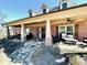 Charming front porch with stone walkway and seating at 4140 Lanier Ridge Walk # 104, Cumming, GA 30041