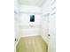 Large walk-in closet with wire shelving and a built-in safe at 4140 Lanier Ridge Walk # 104, Cumming, GA 30041
