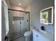 Modern bathroom with a walk-in shower and updated vanity at 935 Pelham Nw St, Atlanta, GA 30318