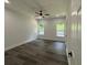Bright bedroom featuring hardwood floors and ceiling fan at 935 Pelham Nw St, Atlanta, GA 30318