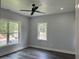 Bright bedroom with large window and ceiling fan at 935 Pelham Nw St, Atlanta, GA 30318