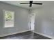 Bedroom with window, ceiling fan, and access to bathroom at 935 Pelham Nw St, Atlanta, GA 30318