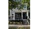 Two-story gray house with a front porch and steps at 935 Pelham Nw St, Atlanta, GA 30318