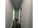 Clean hallway with light grey walls and dark grey floors at 935 Pelham Nw St, Atlanta, GA 30318