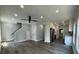 Open concept living area with grey flooring, kitchen, and stairs at 935 Pelham Nw St, Atlanta, GA 30318