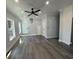 Spacious living room with grey flooring and a ceiling fan at 935 Pelham Nw St, Atlanta, GA 30318