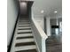 Modern staircase leading to the upper level of the home at 935 Pelham Nw St, Atlanta, GA 30318