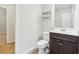 Bathroom with dark vanity and tiled flooring at 189 Aylesbury Blvd, Mcdonough, GA 30252