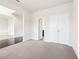 Spacious bedroom with double doors and access to a bathroom at 189 Aylesbury Blvd, Mcdonough, GA 30252