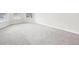 Spacious bedroom with neutral carpeting and large window at 189 Aylesbury Blvd, Mcdonough, GA 30252