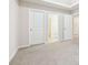 Bedroom with access to another room and neutral decor at 189 Aylesbury Blvd, Mcdonough, GA 30252
