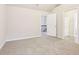 Spacious bedroom with carpeted floor and access to a bathroom at 189 Aylesbury Blvd, Mcdonough, GA 30252
