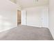 Large bedroom with neutral walls and carpeting at 189 Aylesbury Blvd, Mcdonough, GA 30252