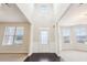 Two-story foyer with hardwood floors and a grand staircase at 189 Aylesbury Blvd, Mcdonough, GA 30252