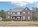 Two-story house with a brick facade and a large yard at 189 Aylesbury Blvd, Mcdonough, GA 30252