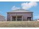 Two-story brick house with covered patio and landscaped yard at 189 Aylesbury Blvd, Mcdonough, GA 30252