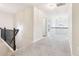Upstairs hallway with carpeted flooring and access to bedrooms at 189 Aylesbury Blvd, Mcdonough, GA 30252