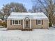 Charming ranch home with snow-covered lawn and updated exterior at 2003 Cogar Dr, Decatur, GA 30032