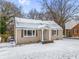 Charming ranch home with snow-covered yard at 2003 Cogar Dr, Decatur, GA 30032