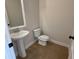Powder room with pedestal sink and neutral tile floors at 4220 Easter Lily Ave (Lot3), Buford, GA 30519