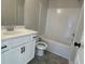 Clean bathroom with white vanity, bathtub, and tiled shower at 4220 Easter Lily Ave (Lot3), Buford, GA 30519