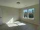 Well-lit bedroom with two windows and wall-to-wall carpet at 4220 Easter Lily Ave (Lot3), Buford, GA 30519
