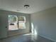 Spacious bedroom with carpet and two large windows at 4220 Easter Lily Ave (Lot3), Buford, GA 30519