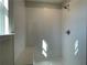 Large walk-in shower with tile surround and bench at 4220 Easter Lily Ave (Lot3), Buford, GA 30519