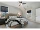 Well-lit bedroom with neutral paint, ceiling fan, and an oversized window at 924 Wemberley Ln, Marietta, GA 30064