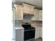 Updated kitchen featuring stainless steel oven and white cabinets at 201 Peyton Sw Pl, Atlanta, GA 30311