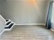 Open-concept living room with tile flooring and large window at 201 Peyton Sw Pl, Atlanta, GA 30311