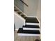 White and black staircase with tile floor at 201 Peyton Sw Pl, Atlanta, GA 30311