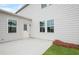 Back patio, with gray siding, white trim, and artificial turf at 1646 Tide Mill Rd, Cumming, GA 30040