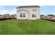 Backyard with lush green lawn and surrounding homes at 1646 Tide Mill Rd, Cumming, GA 30040