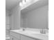 Bathroom with double sinks and a large mirror at 1646 Tide Mill Rd, Cumming, GA 30040