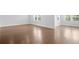 Bright bedroom with hardwood floors, two large windows, and neutral paint at 1646 Tide Mill Rd, Cumming, GA 30040