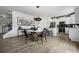 Bright dining area with a round table and modern chairs, adjacent to the kitchen at 1646 Tide Mill Rd, Cumming, GA 30040