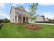 Charming two-story home with brick accents, manicured lawn, and inviting front porch at 1646 Tide Mill Rd, Cumming, GA 30040