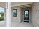 Inviting front porch featuring brick accents, a stylish front door, and ample natural light at 1646 Tide Mill Rd, Cumming, GA 30040