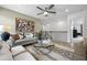 Bright living room features stylish decor, a modern ceiling fan, and lots of natural light at 1646 Tide Mill Rd, Cumming, GA 30040