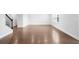 Spacious living room featuring hardwood floors, neutral paint, and bright natural light at 1646 Tide Mill Rd, Cumming, GA 30040