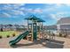 Community playground featuring a slide, climbing apparatus, and sun protection at 1646 Tide Mill Rd, Cumming, GA 30040