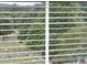 Exterior view through a window with blinds at 1646 Tide Mill Rd, Cumming, GA 30040