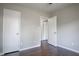 Simple bedroom with dark hardwood floors and closet at 1867 Myrtle Sw Dr # 26, Atlanta, GA 30311